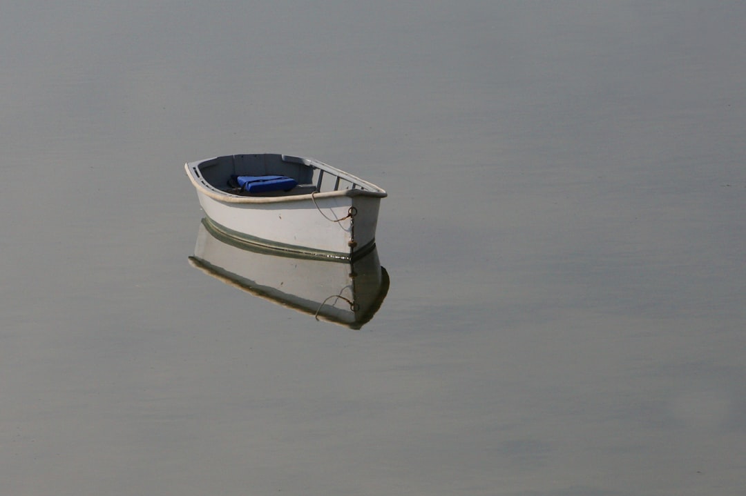 Whale-shaped glass-bottom boat leaving the pier at Busena Marine Park in Nago on a calm weekday morning